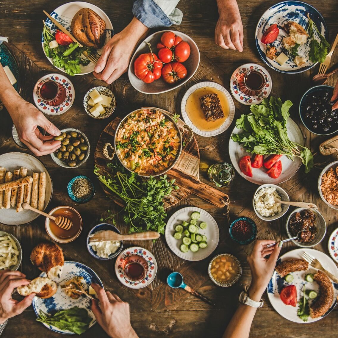 Flat-lay of Turkish family having traditional breakfast with various food